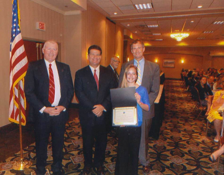 Civic leader pose with citizenship award winner.